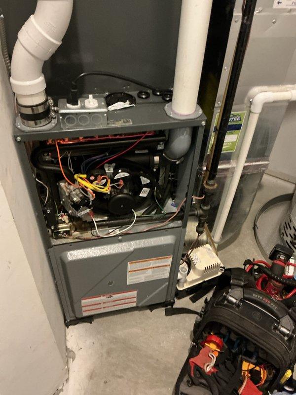 Completed comprehensive multi-system tune-up maintenance including two air conditioning units, two gas furnaces, and two water heaters. Performed combustion analysis on gas furnace using digital flue gas analyzer, confirming proper natural gas combustion efficiency and safe operation with readings within manufacturer specifications. Inspected furnace internal components, electrical connections, and PVC venting system, verifying all wiring harnesses and mechanical assemblies functioning correctly.