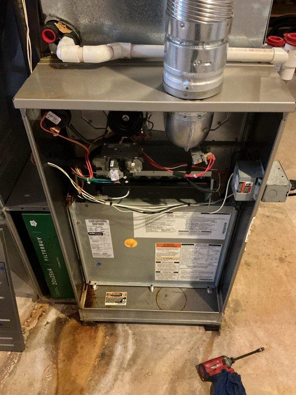 Performed comprehensive tune-up and inspection on Carrier furnace unit for city certification requirements. Conducted full system evaluation including internal component inspection, electrical connections check, and verification of all mechanical operations. Noted floor staining beneath unit indicating previous moisture presence; all components currently functioning within normal parameters and system approved for certification.