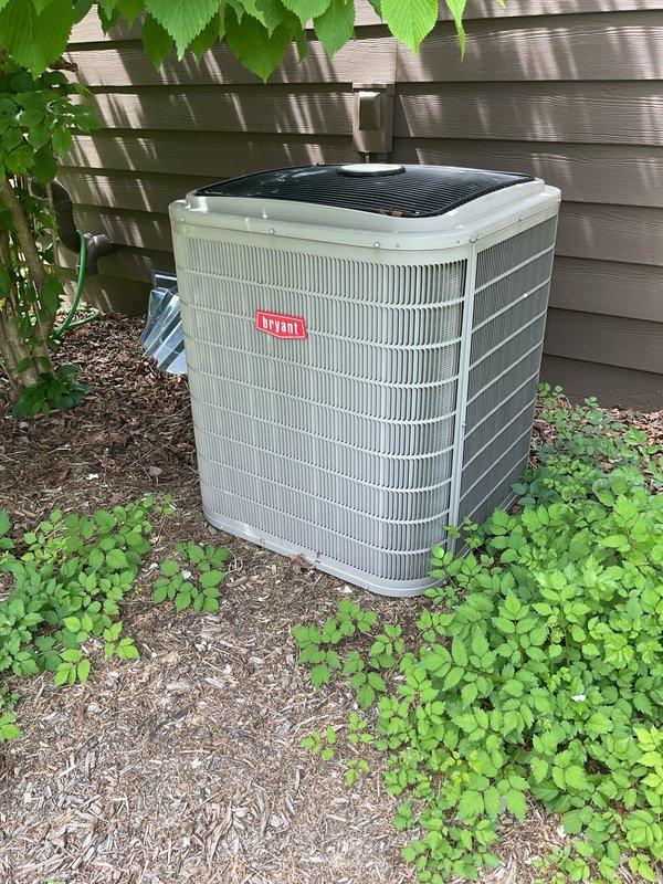 Completed scheduled preventive maintenance on 2016 Bryant air conditioning system. Performed comprehensive tune-up including inspection of condenser unit, verification of electrical connections at disconnect box, assessment of refrigerant levels, and evaluation of heat exchanger fins. Unit found in operational condition with adequate clearance from structure and proper installation on concrete pad. All components functioning within normal parameters upon completion of maintenance service.