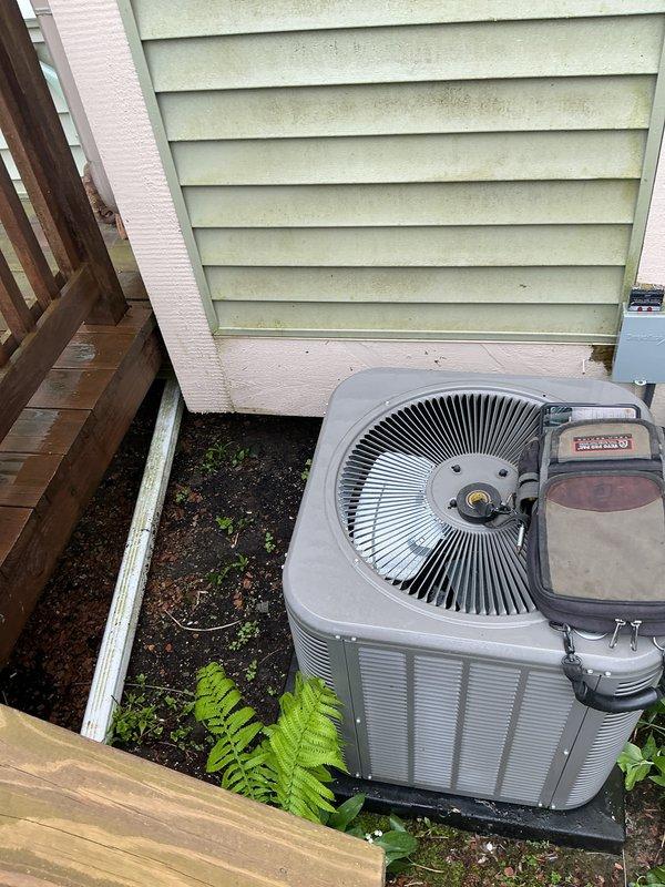 Performed comprehensive air conditioning tune-up and preventative maintenance on 2023 residential outdoor condenser unit. Completed full system inspection, verified proper operation of fan assembly and electrical components, and ensured unit clearances were adequate despite proximity to deck structure and landscaping. All systems found operating within normal parameters.