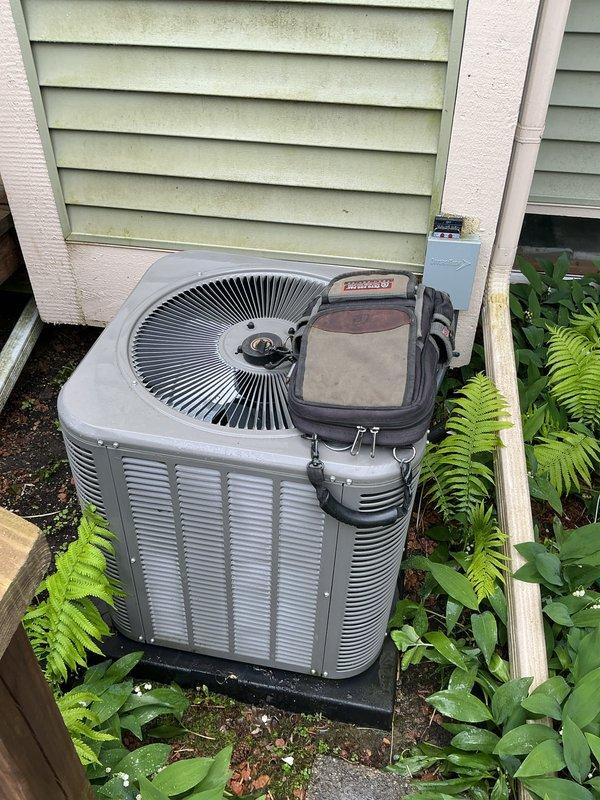 Performed comprehensive air conditioning tune-up and preventative maintenance on 2023 residential outdoor condenser unit. Completed full system inspection, verified proper operation of fan assembly and electrical components, and ensured unit clearances were adequate despite proximity to deck structure and landscaping. All systems found operating within normal parameters.