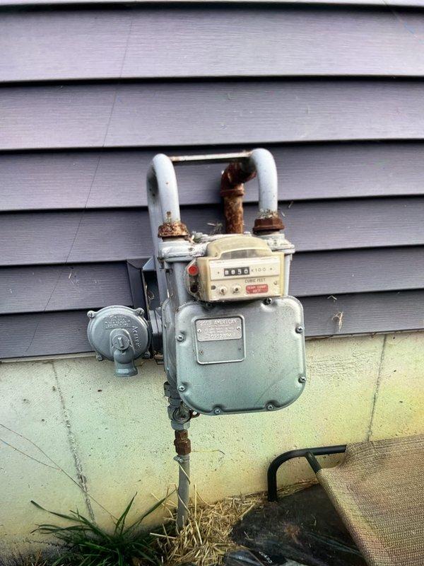 Responded to callback for reported unusual odor following recent HVAC installation. Upon arrival, conducted thorough inspection of water heater installation and gas meter connections. Examined all copper piping, valves, and fittings on water heater unit for proper installation and potential gas leaks. Inspected exterior gas meter and discovered significant corrosion on connecting pipes, which was identified as the source of concern. Verified all connections were secure and performed combustion analysis to ensure safe operation. Documented equipment conditions with photographs for service records. System operating within normal parameters with no active safety concerns detected at time of inspection.
