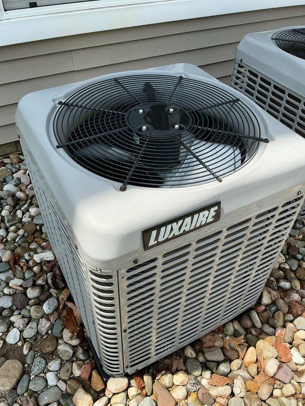 Performed comprehensive air conditioning tune-up and preventive maintenance on dual Luxaire condensing units located on exterior gravel pad. Completed full system inspection, cleaned condenser coils, verified refrigerant levels, tested electrical components, and confirmed proper operation of both units. All systems operating within manufacturer specifications with no issues identified.