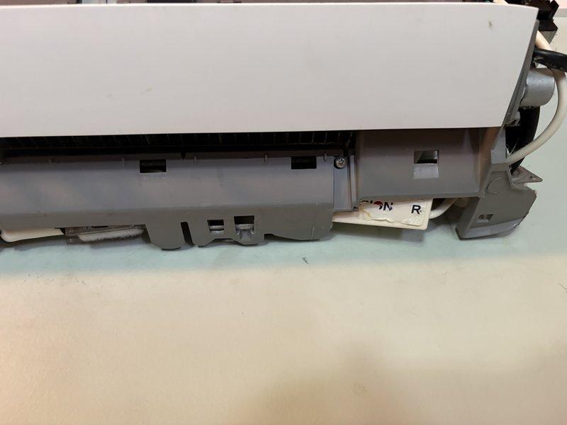 Responded to follow-up call regarding continued leak concerns after previous service visit. Inspected mini split system and associated drain components. Upon investigation, verified all refrigerant connections were properly secured from prior repair. Discovered drain tube was not fully seated in condensate drain pan, causing water leakage from a different location than original issue. Reseated and secured drain line connections. Documented interior unit mounting and under-cabinet plumbing configuration for service records.