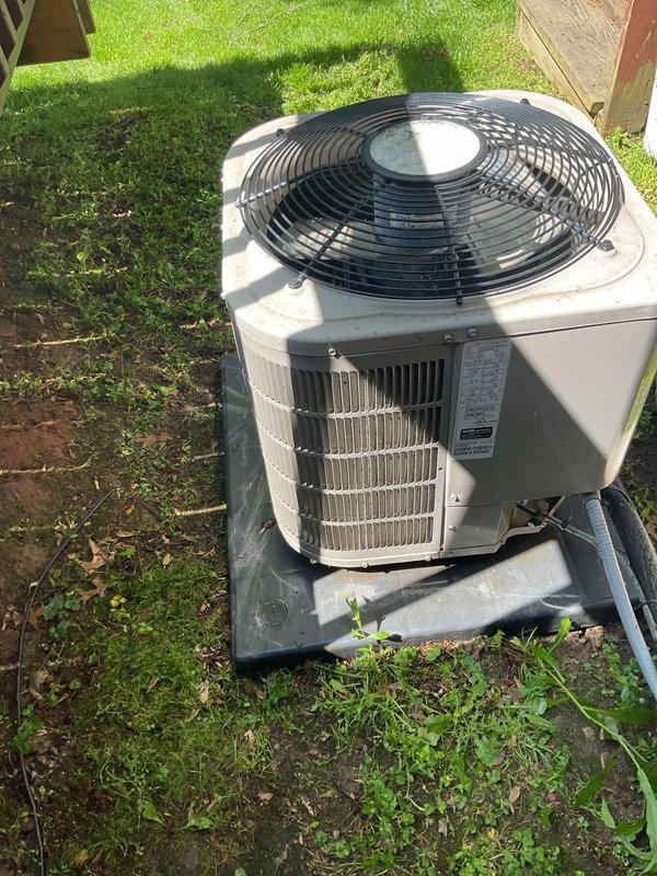 Completed scheduled air conditioning tune-up and preventive maintenance on residential outdoor condensing unit. Performed comprehensive system inspection including visual assessment of condenser cabinet, fan assembly, refrigerant line insulation, and mounting pad stability. Unit found in operational condition with proper placement on composite pad and adequate clearance from surrounding structures. Verified electrical connections, confirmed fan operation, and documented equipment condition through photographic records for maintenance history.