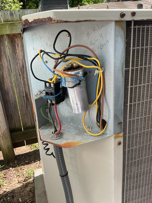 Completed comprehensive air conditioning tune-up on outdoor condensing unit. Performed full system inspection, checked electrical components including capacitor and contactor relay within control panel, verified proper operation of condenser fan motor, and confirmed refrigerant line connections were secure. All components found operating within normal parameters; unit ready for cooling season.