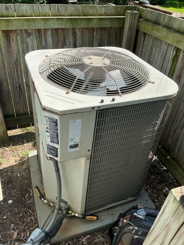 Completed comprehensive air conditioning tune-up on outdoor condensing unit. Performed full system inspection, checked electrical components including capacitor and contactor relay within control panel, verified proper operation of condenser fan motor, and confirmed refrigerant line connections were secure. All components found operating within normal parameters; unit ready for cooling season.