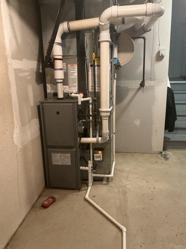 Returned to property for warranty follow-up on recently installed AC system to diagnose furnace ignition failure with suspected gas valve malfunction. Upon inspection of the HVAC installation in basement utility area, verified proper configuration of furnace unit, PVC venting system, and associated piping network. Evaluated gas valve operation, electrical connections, and ignition sequence to determine if issue was related to recent AC installation work completed the previous week.
