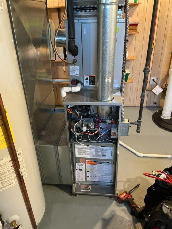 Completed annual HVAC maintenance and tune-up on residential furnace system in basement utility area. Performed comprehensive inspection of furnace unit, blower motor assembly, internal components, and ductwork connections. All equipment found operating within normal parameters with no issues identified.