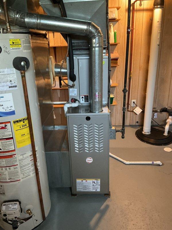 Completed annual HVAC maintenance and tune-up on residential furnace system in basement utility area. Performed comprehensive inspection of furnace unit, blower motor assembly, internal components, and ductwork connections. All equipment found operating within normal parameters with no issues identified.