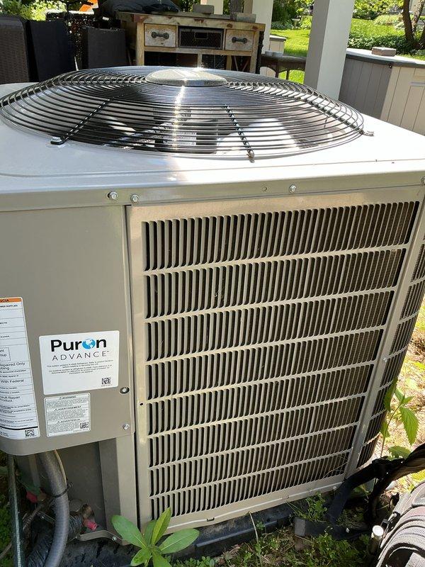 Completed preventative maintenance tune-up on a Puron ADVANCE air conditioning system less than one year old. Performed comprehensive inspection of condenser unit, verified all components operating within normal parameters, checked refrigerant levels, inspected heat exchanger fins and fan assembly, and confirmed system functionality with no issues found.