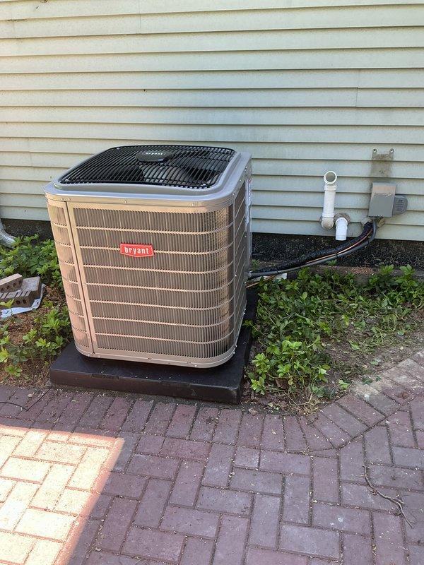 Completed full installation of Bryant air conditioning system with new evaporator coil. Unit was mounted on platform pad with proper leveling, all refrigerant lines were insulated and routed to exterior wall penetration, electrical disconnect installed per code, and system was tested for proper operation. Documentation and identification were collected and financing paperwork was processed and signed.