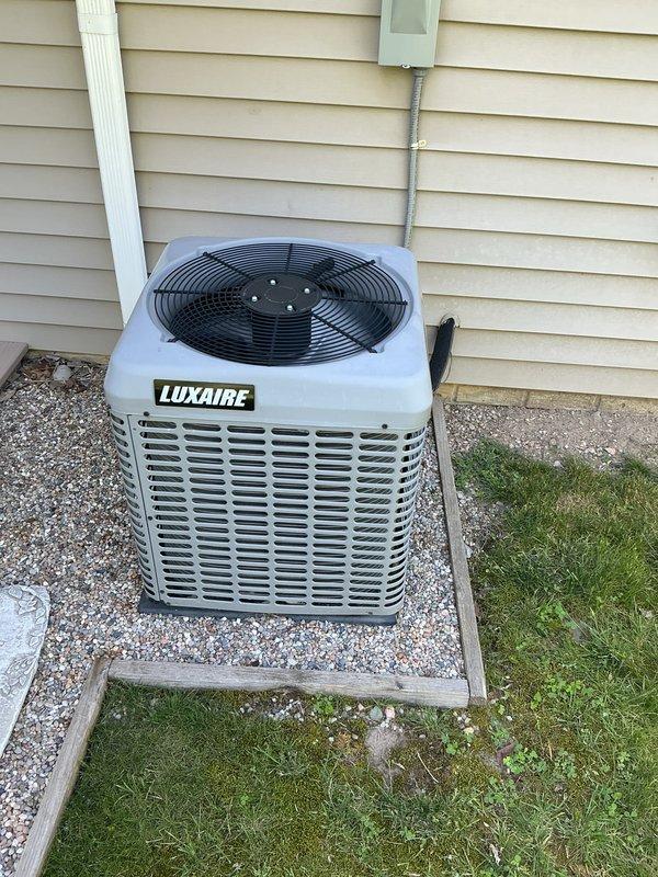 Completed scheduled cooling system tune-up on Luxaire condensing unit. Performed comprehensive preventive maintenance inspection, verified proper operation of all components, and documented equipment condition with photos of unit nameplate and installation.