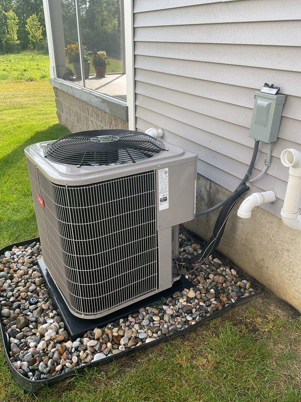 Completed comprehensive air conditioning tune-up and preventive maintenance on outdoor condensing unit. System was thoroughly inspected, tested, and confirmed to be operating efficiently in cooling mode with all components functioning within normal parameters. Unit and surrounding area were found to be clean and well-maintained with proper drainage support.