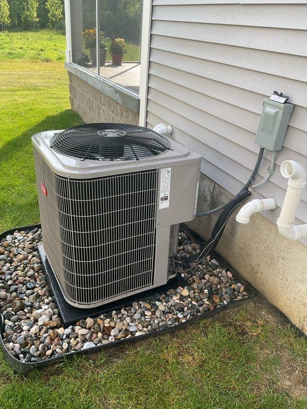 Completed comprehensive air conditioning tune-up and preventive maintenance on outdoor condensing unit. System was thoroughly inspected, tested, and confirmed to be operating efficiently in cooling mode with all components functioning within normal parameters. Unit and surrounding area were found to be clean and well-maintained with proper drainage support.