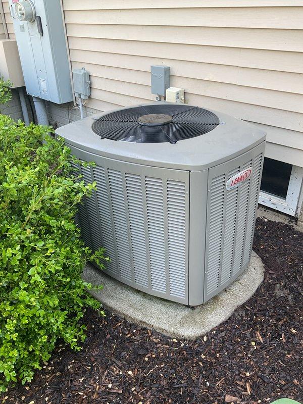 Completed annual AC tune-up and preventive maintenance on 2023 Lennox condenser unit. Renewed maintenance membership agreement and replaced low thermostat batteries under installation warranty. Outdoor unit showed normal operational wear with dust and debris accumulation on housing and coil fins; performed standard cleaning and inspection procedures to ensure optimal system performance for the cooling season.