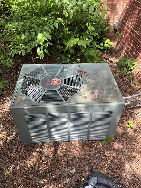 Performed comprehensive AC tune-up on 35-year-old Rheem outdoor condensing unit. Inspected condenser coils, fan assembly, refrigerant lines, and electrical connections; cleaned debris from unit exterior and surrounding area; verified proper airflow through louvers and fan operation. System tested and confirmed operational with all components functioning within normal parameters.