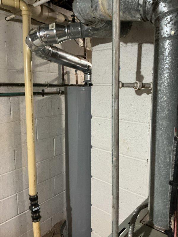 Completed installation of new air conditioning system with evaporator coil in basement utility area. Installed ductwork connections, refrigerant lines, condensate drainage piping, and electrical wiring to integrate new A/C unit with existing HVAC infrastructure. All components properly mounted, secured, and tested for operational functionality with system running efficiently upon completion.