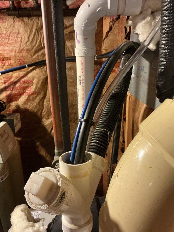 Completed installation of new air conditioning system and evaporator coil. Installed condensate drain assembly with PVC piping and cleanout access port in attic space, routing drainage lines through exterior wall with proper pitch and termination points. Verified all refrigerant lines, electrical connections, and drainage components are properly secured and functioning to manufacturer specifications.