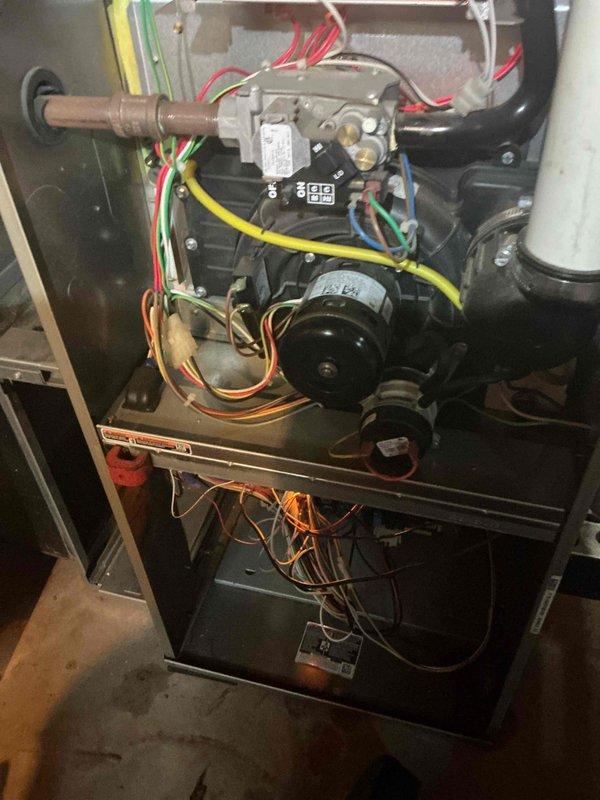 Completed comprehensive tune-up service on both air conditioning and gas furnace systems. Performed thorough inspection of furnace components including gas valve assembly, blower motor, electrical connections, and safety controls with all wiring harnesses verified for proper connections and condition. Documented internal components showing normal operational wear, confirmed proper gas line connections, and verified condensate drainage system integrity. All systems tested and operating within manufacturer specifications.