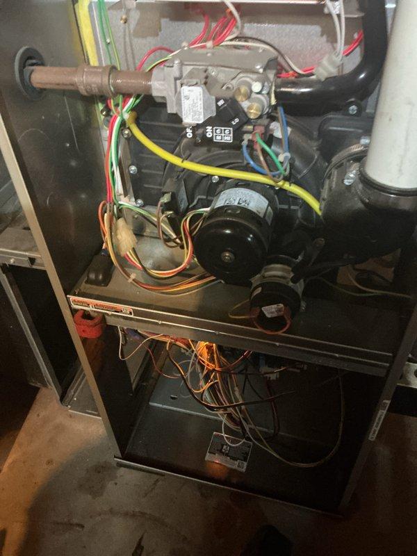 Completed comprehensive tune-up service on both air conditioning and gas furnace systems. Performed thorough inspection of furnace components including gas valve assembly, blower motor, electrical connections, and safety controls with all wiring harnesses verified for proper connections and condition. Documented internal components showing normal operational wear, confirmed proper gas line connections, and verified condensate drainage system integrity. All systems tested and operating within manufacturer specifications.