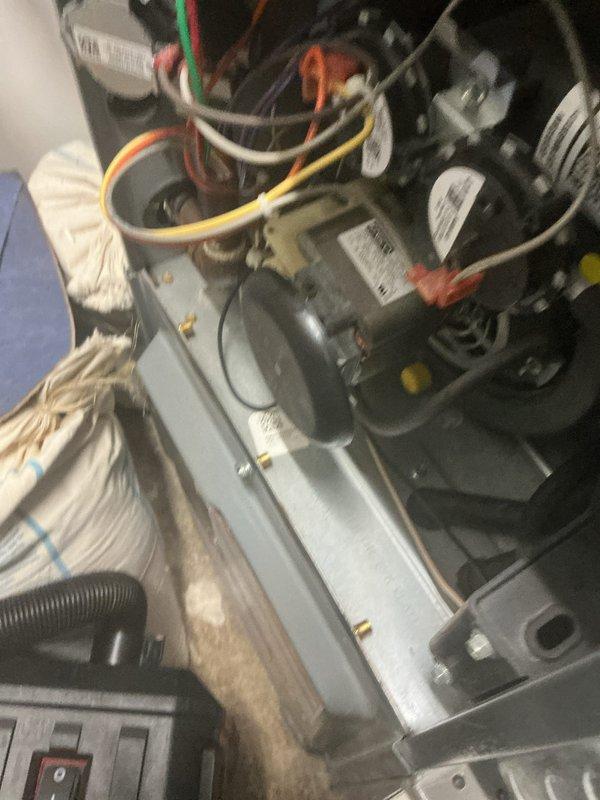 Performed preventative maintenance tune-up on rooftop commercial-style AC/gas furnace combination unit. Accessed internal components, inspected blower motor assembly, heat exchanger, electrical connections, and condensate drain system. All components found operational with wiring secure and unit functioning within normal parameters.