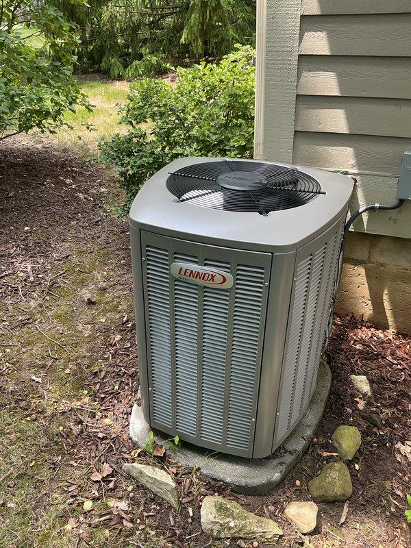 Performed complete air conditioning tune-up on Lennox condensing unit and reset thermostat to restore proper cooling operation. Provided instruction on thermostat programming to enable customer to independently set and adjust temperature schedules. Unit inspected and found to be in normal operating condition with no visible deficiencies noted.