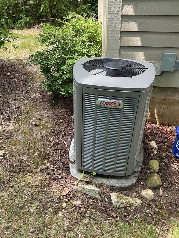 Performed complete air conditioning tune-up on Lennox condensing unit and reset thermostat to restore proper cooling operation. Provided instruction on thermostat programming to enable customer to independently set and adjust temperature schedules. Unit inspected and found to be in normal operating condition with no visible deficiencies noted.