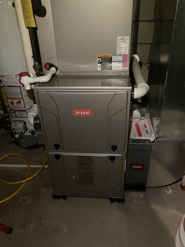 Completed routine maintenance and tune-up on Bryant residential HVAC system including both furnace and air conditioning units. Performed comprehensive inspection of outdoor condenser unit positioned on concrete pad, verified proper operation of compressor and fan motor, cleaned condenser coils, and checked refrigerant levels. Inspected indoor furnace unit in mechanical room, examined heat exchanger, tested blower motor operation, verified proper venting through PVC piping, checked gas connections including flexible gas line, and confirmed all safety controls functioning correctly. Both systems operating within normal parameters with no issues identified during inspection.
