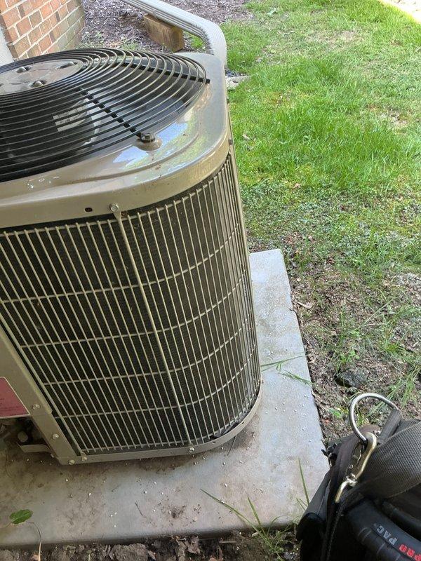 Completed comprehensive tune-up on 15-year-old outdoor AC condenser unit. Performed standard maintenance procedures including inspection of cylindrical condenser coils, fan assembly verification, refrigerant line check, and electrical component testing. Unit operational upon completion with all systems functioning within normal parameters.