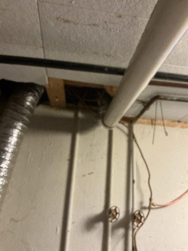 Completed installation of new air conditioning system with evaporator coil in residential basement utility room. System was integrated with existing Bryant furnace and connected to ductwork, with all refrigerant lines, condensate drainage, and electrical connections properly installed and tested for optimal operation.