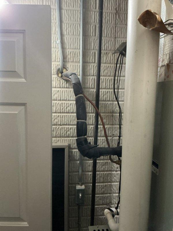 Responded to customer report of air conditioning system struggling to satisfy thermostat setpoint. Performed diagnostic evaluation of refrigeration system using digital manifold gauge set, measuring suction pressure at 42.3 psig and discharge pressure at 165.5 psig with corresponding temperature readings. Inspected indoor unit and refrigerant line set installation in utility space. System requires additional repairs to restore proper cooling capacity and performance.