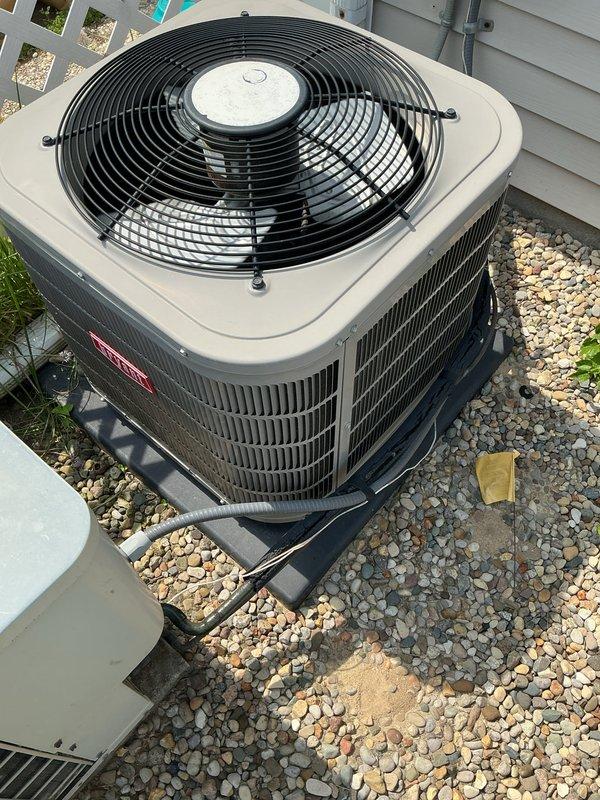 Performed routine preventative maintenance on a five-year-old residential air conditioning system with two outdoor condensing units. Completed comprehensive tune-up including inspection of condenser coils, fan assemblies, refrigerant lines, and electrical connections. System operating within normal parameters with no deficiencies noted at time of service.