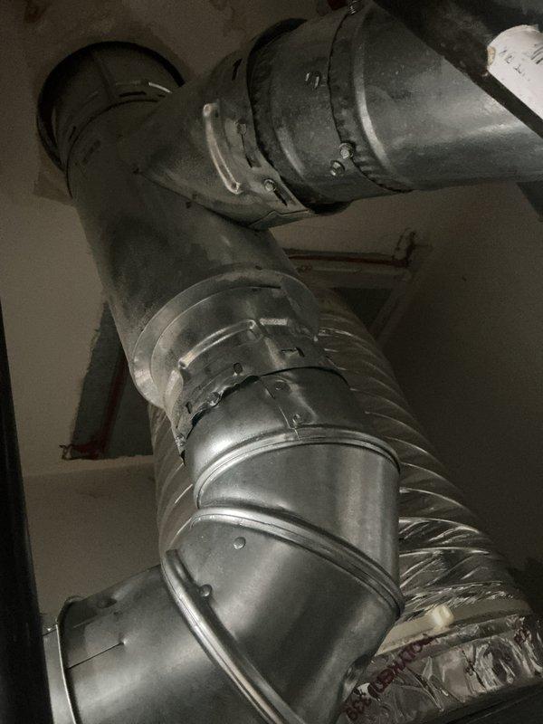 Completed full HVAC system installation including outdoor condensing unit mounted on concrete pad with proper electrical disconnects and conduit installation, along with interior flexible and rigid ductwork components properly secured with metal straps and clamps. All ductwork connections fastened at junction points to ensure proper airflow throughout the system. Financing paperwork processed and identification documentation collected per company protocol.