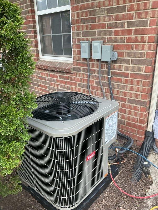 Completed full HVAC system installation including outdoor condensing unit mounted on concrete pad with proper electrical disconnects and conduit installation, along with interior flexible and rigid ductwork components properly secured with metal straps and clamps. All ductwork connections fastened at junction points to ensure proper airflow throughout the system. Financing paperwork processed and identification documentation collected per company protocol.