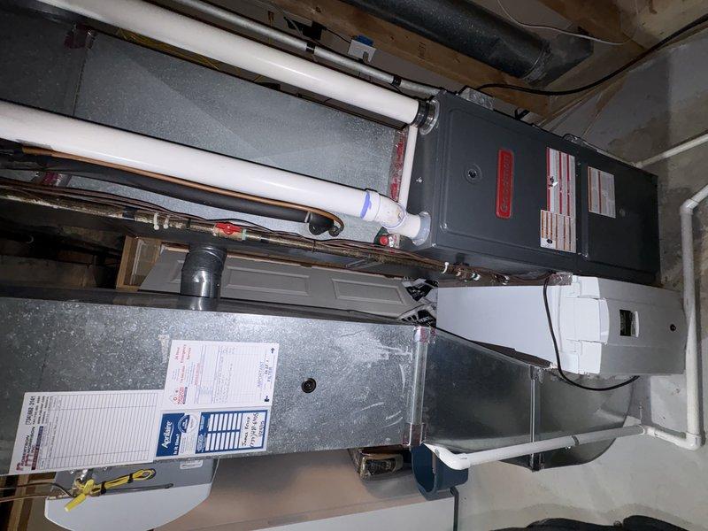 Responded to no cooling complaint and performed diagnostic evaluation of residential HVAC system. Inspected furnace and air handler installation in basement mechanical room, documenting equipment condition and configuration. System components including ductwork, air handler, and furnace unit were visually assessed for operational issues. Provided quote for replacement equipment as requested while maintaining scheduled maintenance appointment.
