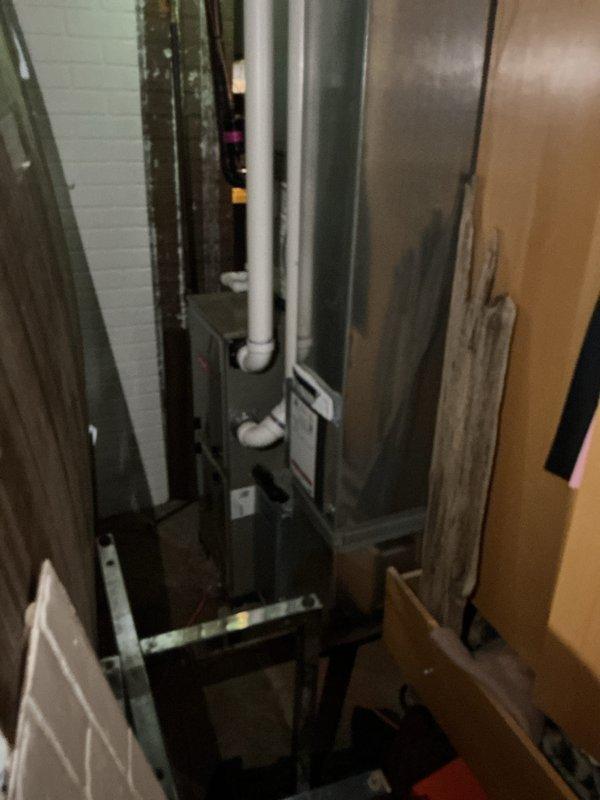 Completed installation of new air conditioning system with evaporator coil in mechanical space. Installed condenser unit, connected refrigerant lines, mounted evaporator coil, and established proper drainage with PVC piping. Performed electrical connections, tested system operation, and verified proper airflow and cooling performance.