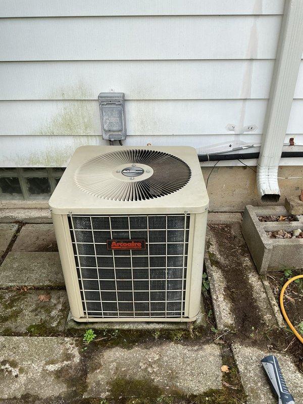 Responded to service call for air conditioning unit not cooling properly after customer disassembled unit for cleaning. Upon arrival, inspected Arcoaire outdoor condenser unit and verified electrical connections at main panel. Unit was reassembled and tested for proper operation, with cooling performance restored to normal specifications.
