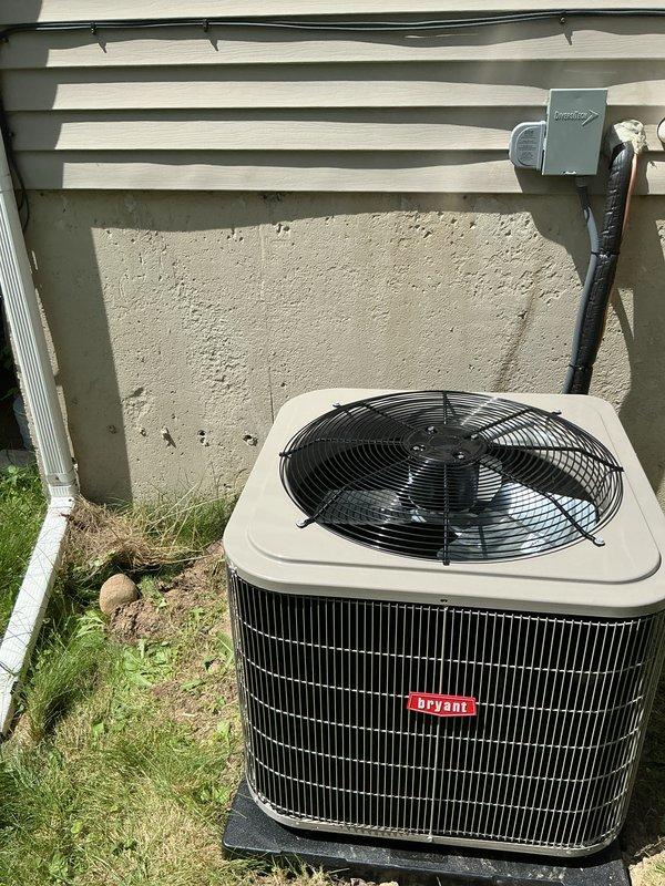 Completed full HVAC system installation including new Bryant furnace and air conditioning condenser unit. Installed furnace in basement mechanical room with proper ductwork connections and PVC condensate drain line, mounted outdoor condenser unit on concrete pad with electrical disconnect box and proper clearances from building exterior. All equipment tested and operational, financing documentation completed and identification verified on file.