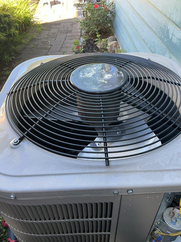 Completed annual AC tune-up on 9-year-old outdoor condenser unit. Performed standard preventive maintenance inspection, verified system operation after previous reset, and confirmed unit is functioning properly with clean exterior surfaces and operational fan assembly.