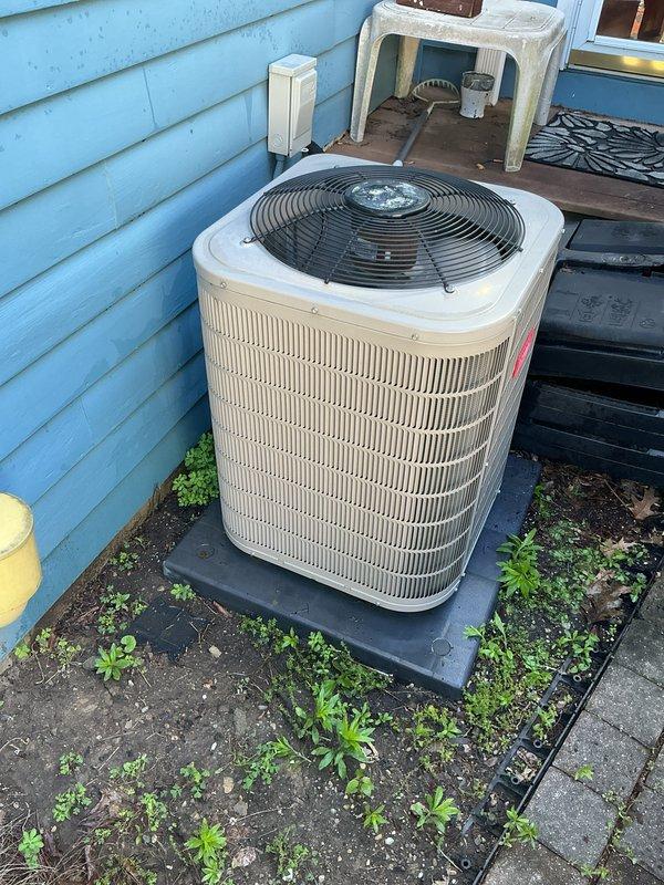 Completed annual AC tune-up on 9-year-old outdoor condenser unit. Performed standard preventive maintenance inspection, verified system operation after previous reset, and confirmed unit is functioning properly with clean exterior surfaces and operational fan assembly.