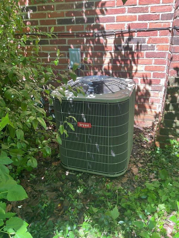 Responded to water leak complaint at residential property. Upon arrival, inspected Bryant outdoor condenser unit located against exterior brick wall. Conducted thorough visual examination of unit and surrounding area for signs of water accumulation or drainage issues. Unit appeared to be in good operational condition with no visible refrigerant leaks or condensate drain blockages observed at time of inspection. Verified proper installation and clearances around equipment.