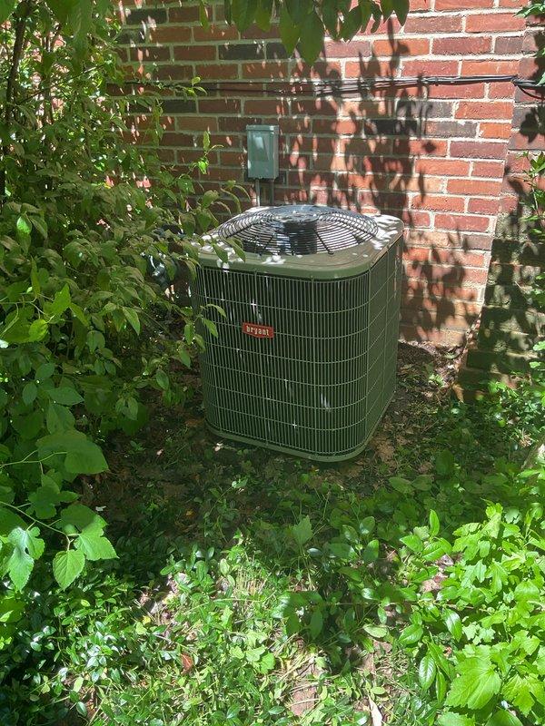 Responded to water leak complaint at residential property. Upon arrival, inspected Bryant outdoor condenser unit located against exterior brick wall. Conducted thorough visual examination of unit and surrounding area for signs of water accumulation or drainage issues. Unit appeared to be in good operational condition with no visible refrigerant leaks or condensate drain blockages observed at time of inspection. Verified proper installation and clearances around equipment.