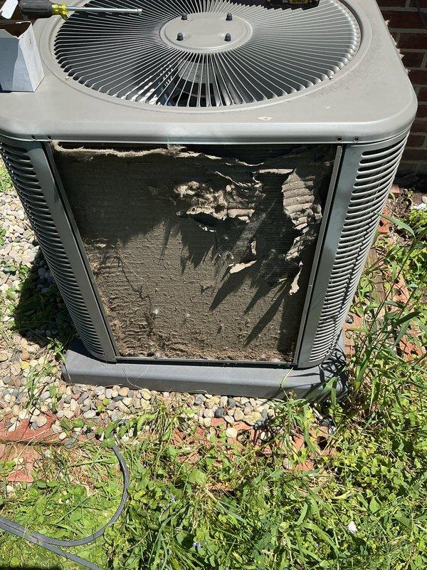 Responded to service call for air conditioning system blowing warm air. Upon arrival, performed diagnostic inspection of outdoor condensing unit, which showed significant exterior panel deterioration and weathering. Assessed unit operation and documented equipment condition with photos for service records.