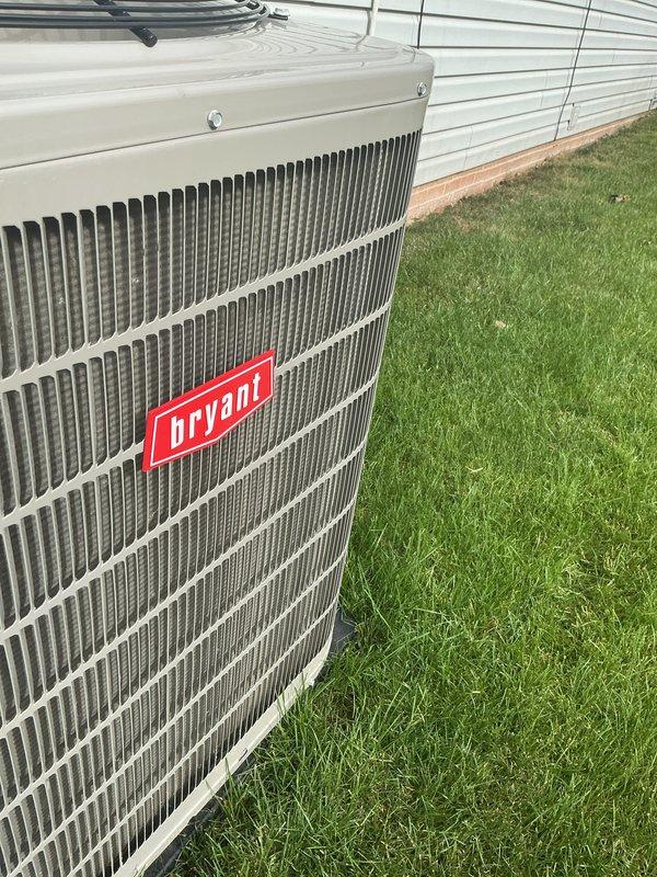 Completed comprehensive multi-system tune-up on Bryant air conditioning unit and hot water heater. Performed standard preventive maintenance procedures including inspection of condenser unit exterior condition, verification of proper airflow through vertical fin grille assembly, and assessment of overall system operation. Unit showed good operating condition with no visible deterioration or damage to housing, fins, or protective fan guard. Customer expressed interest in air purification upgrade options and renewal was processed on-site.