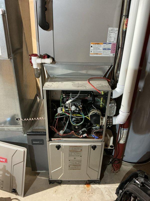 Completed comprehensive tune-up service on residential air conditioning and furnace system. Performed standard maintenance procedures including inspection of internal components, electrical connections, and system controls. Noted significant rust and corrosion present on copper tubing and internal surfaces of furnace unit, indicating possible moisture intrusion or condensate drainage issues. Customer reported extended cooling times; system operation observed and documented for potential follow-up evaluation of AC performance and capacity concerns.