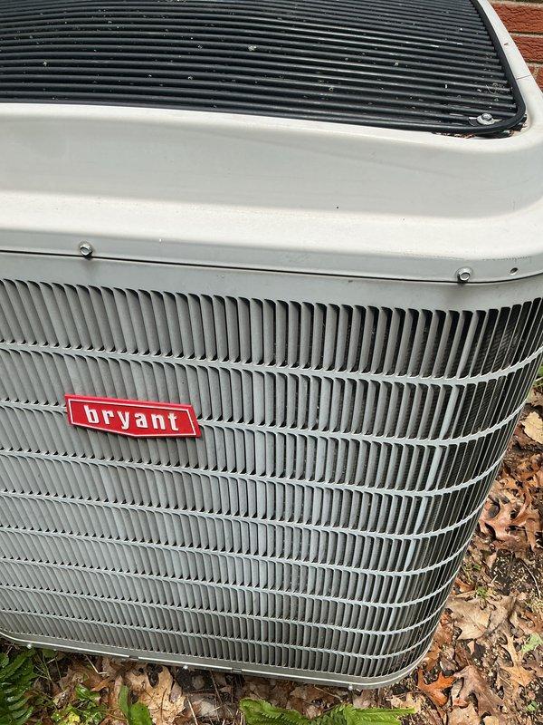 Completed scheduled air conditioning tune-up on Bryant outdoor condensing unit. Performed comprehensive system inspection, cleaned condenser coils, removed accumulated debris and leaves from top grille and surrounding area, verified proper operation of all components, and confirmed unit is functioning within normal parameters for optimal cooling performance.
