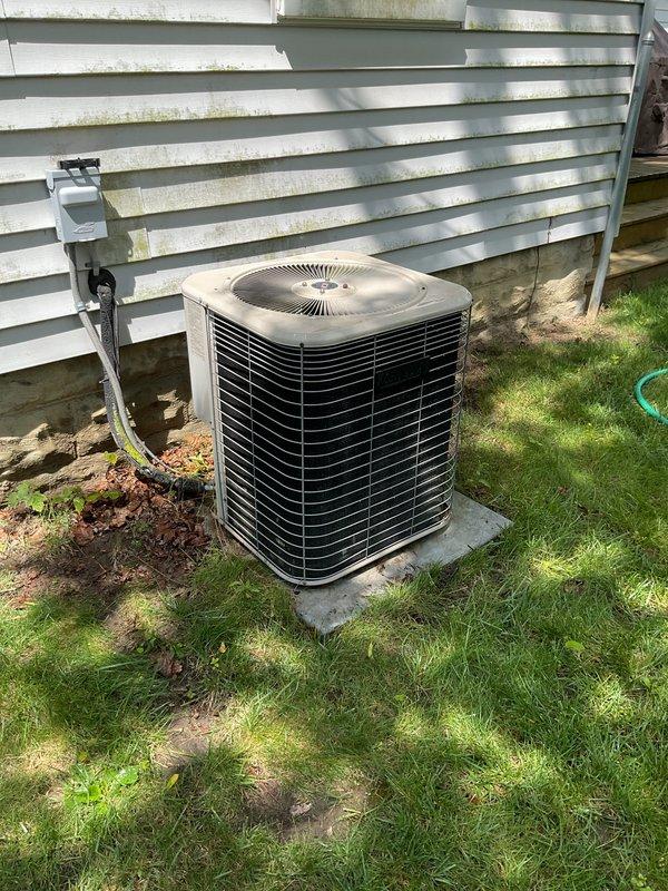 Completed comprehensive air conditioning tune-up and preventative maintenance on outdoor condensing unit. Performed standard seasonal inspection including cleaning of condenser coils, verification of electrical connections at disconnect box, refrigerant level assessment, and operational testing of fan motor and compressor. Unit found to be operating within normal parameters with no immediate service needs identified.