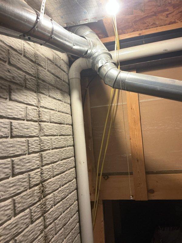 Completed installation of new Lennox air conditioning system in residential basement mechanical room. Unit was positioned alongside existing furnace with proper clearances maintained, connected to existing ductwork infrastructure via metal supply plenum, and all electrical and refrigerant line connections were made per manufacturer specifications. System was tested for proper operation, refrigerant charge verified, and customer provided with 10-year parts and labor warranty documentation.