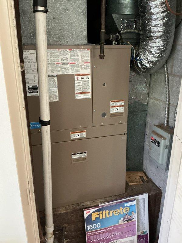 Completed comprehensive AC tune-up on residential split system with air handler located in attic space and outdoor condenser unit accessible via roof access. Performed full preventive maintenance protocol including filter inspection, electrical connections verification, refrigerant level assessment, condensate drain line check, and system operational testing. All components found operating within manufacturer specifications with green status indicator illuminated, confirming proper system function upon completion.